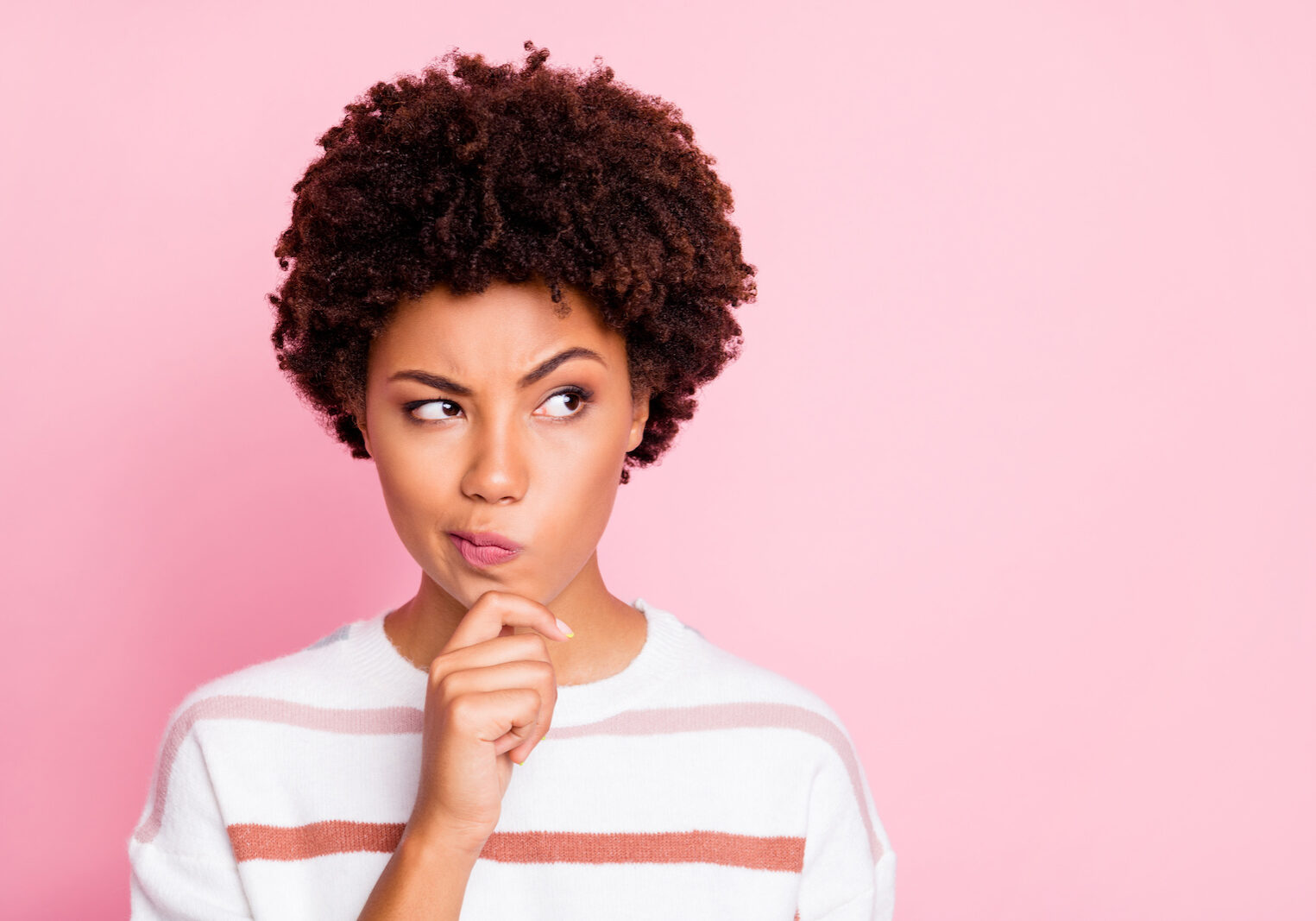 Closeup photo of pretty dark skin lady thinking about important business, startup decision touch chin wear white striped pullover isolated pink color background